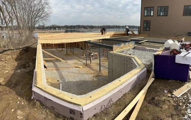 Insulated foundation and floor system for a new home, ready for wall framing