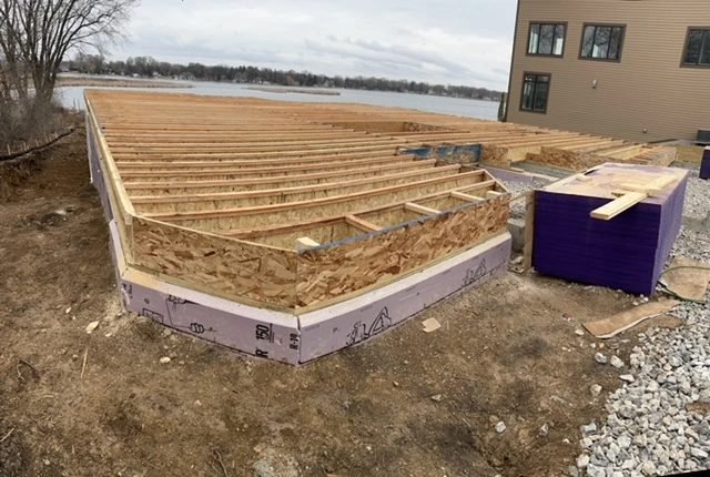 Floor system going down over an insulated foundation in winter