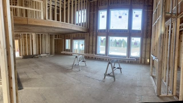 Interior walls framed around a bank of windows in a new home