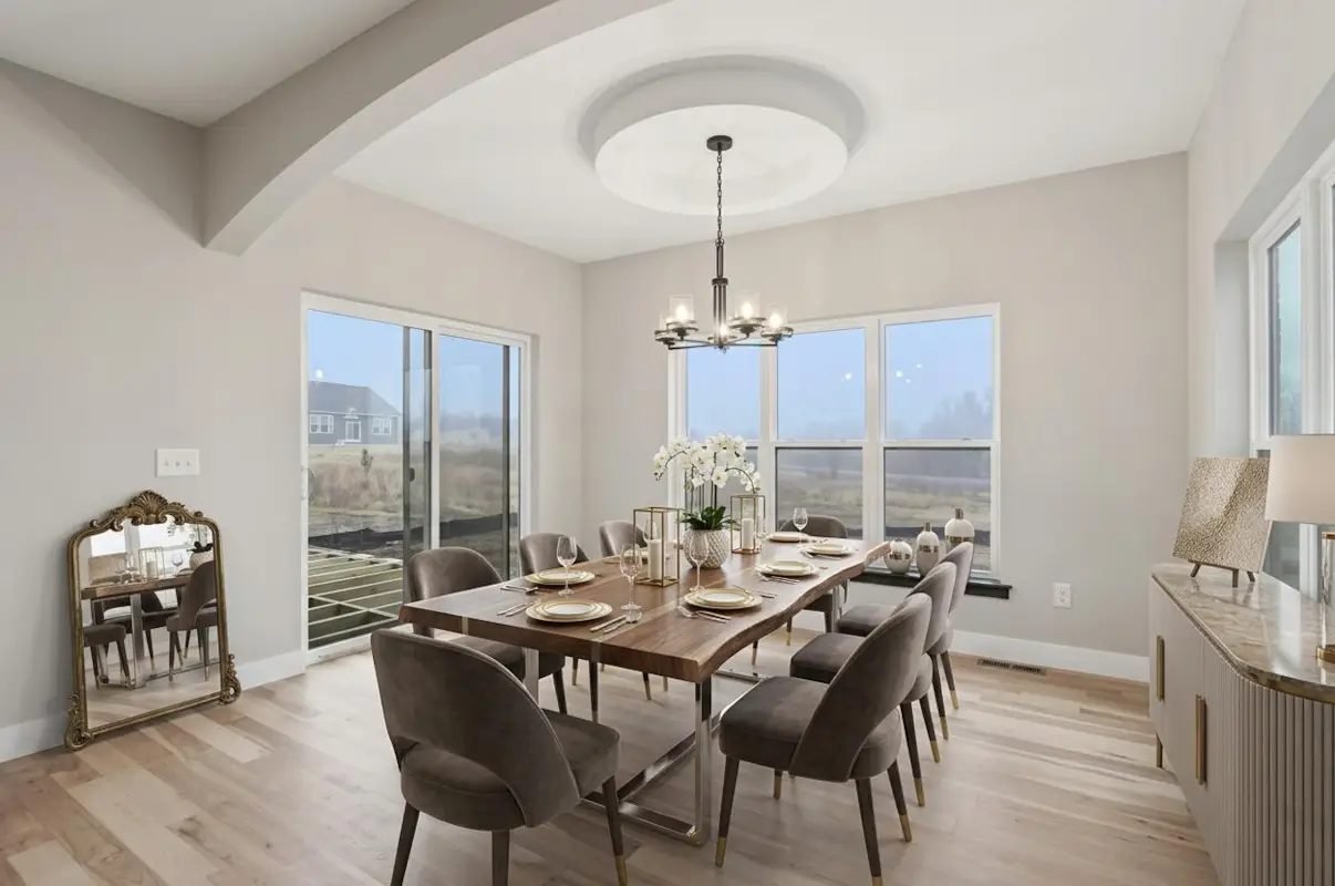 Dining room under an arched beam ceiling, with sliding doors onto the rear of the lot