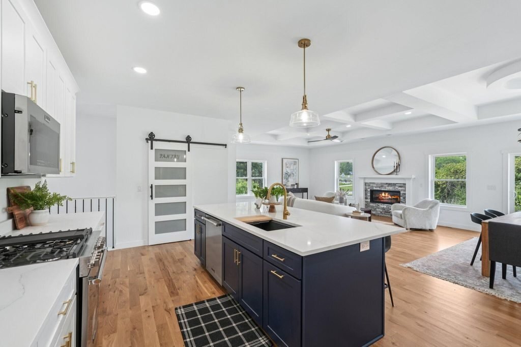 Kitchen looking through to the living room, with a coffered ceiling overhead